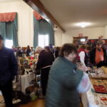 People browsing items at a flea market.