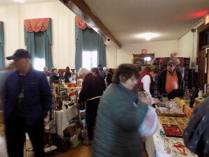 People browsing items at a flea market.