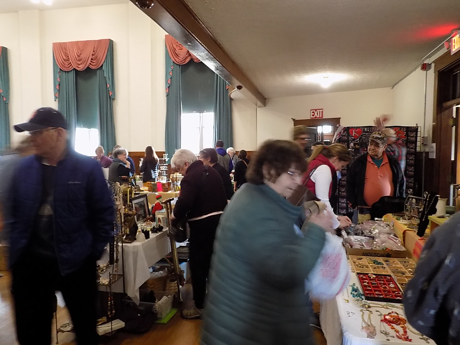 People browsing items at a flea market.