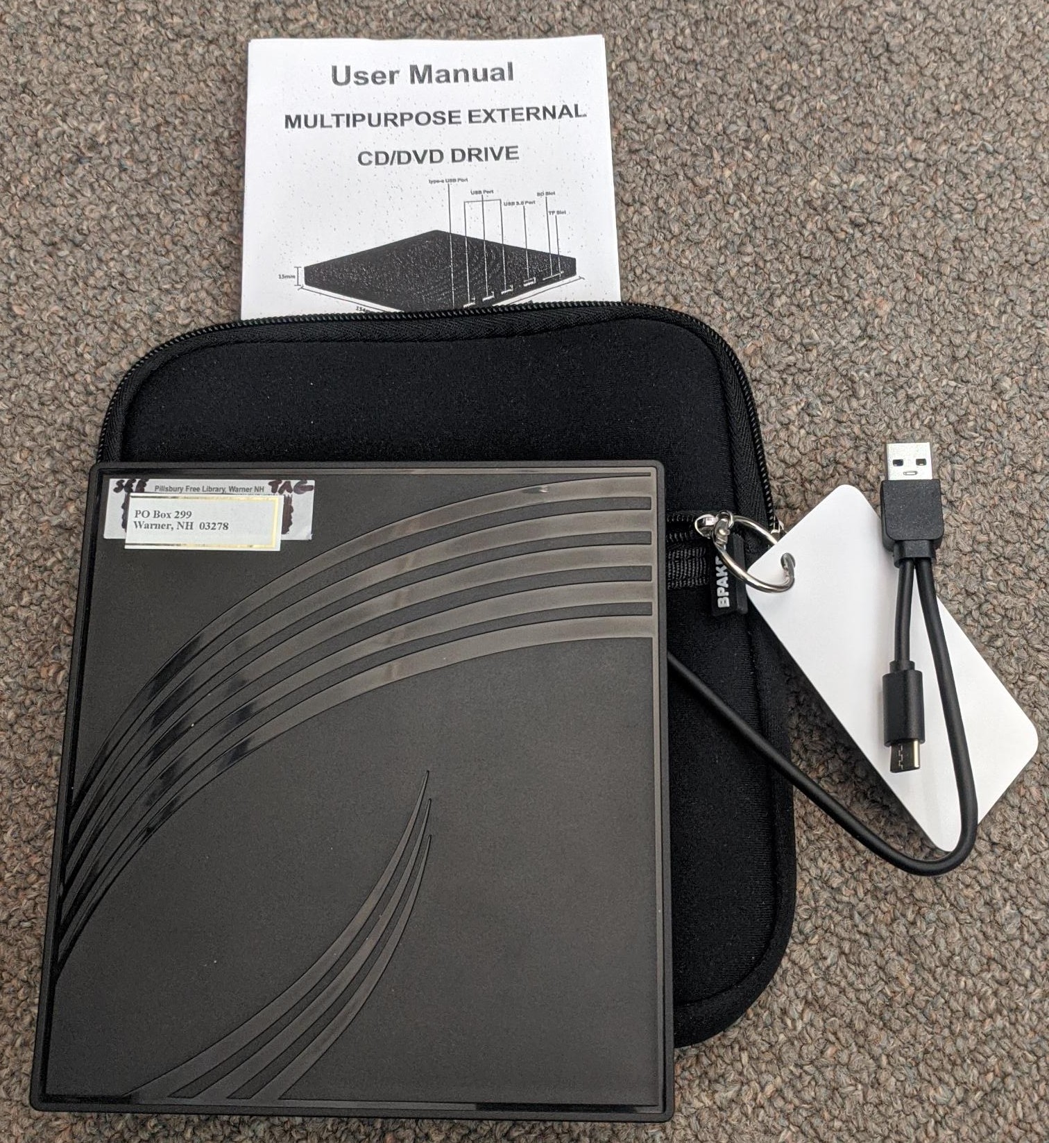 Image of a small black DVD or CD player and carry case.